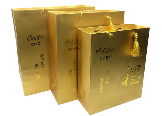 Mua Túi quà tặng bằng giấy vàng in sang trọng tùy chỉnh với tay cầm tua rua có logo nổi online manufacture